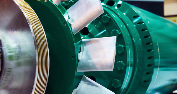 A close-up of a newly manufactured ASEA GTP-type rotor painted forest green.