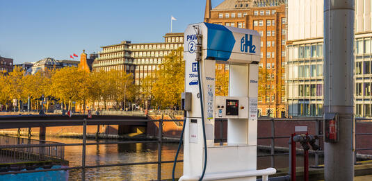 Hydrogen H2 fuel pump in the city of Hamburg, houses in the background